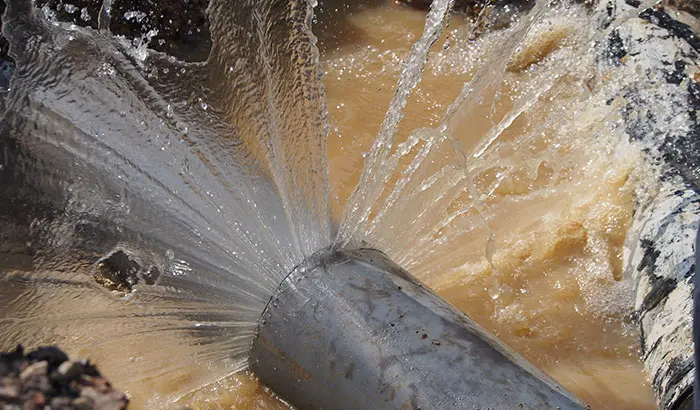 A broken supply line spraying water